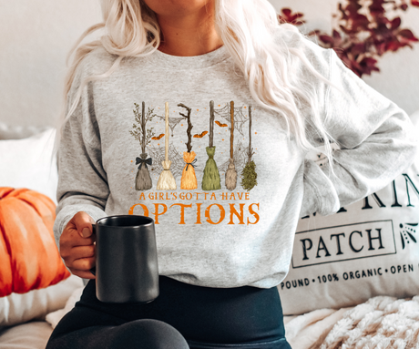A Girl’s Gotta Have Options Broomstick Sweatshirt